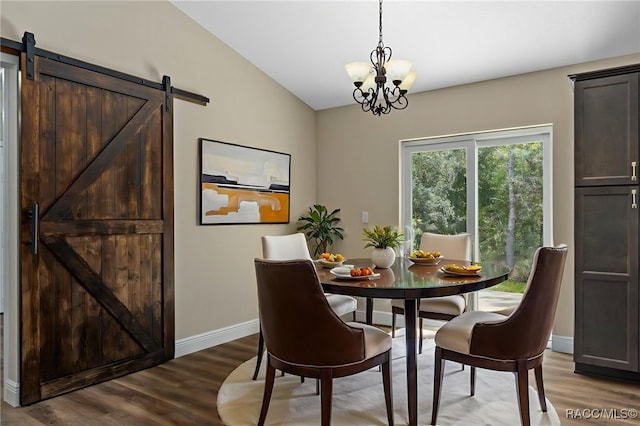 977 W Homeway Loop, Citrus Springs, FL 34434 - dining area featuring wood finished floors, a chandelier, vaulted ceiling, and a barn door