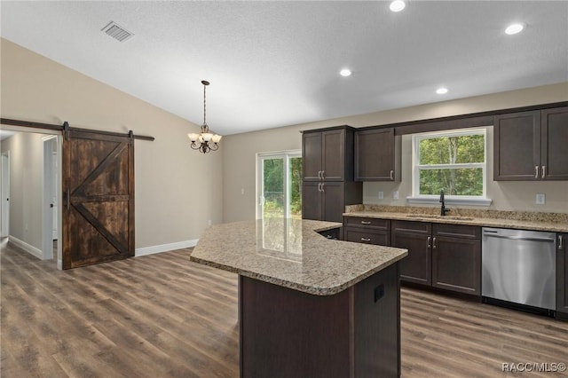 977 W Homeway Loop, Citrus Springs, FL 34434 - kitchen with stainless steel dishwasher, vaulted ceiling, plenty of natural light, dark wood-style floors, and dark brown cabinets