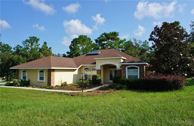 view of front of home with a front lawn