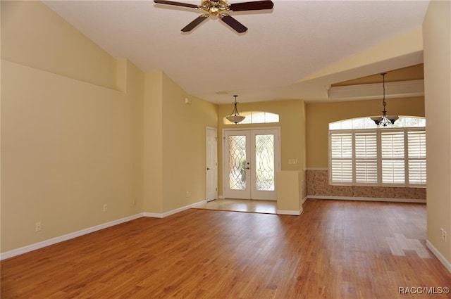 entryway with hardwood / wood-style flooring, a wealth of natural light, and french doors