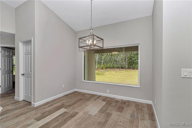 5443 N Nakoma Dr, Beverly Hills, FL 34465 - unfurnished dining area with a chandelier and wood finished floors