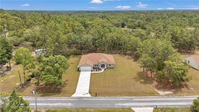 5443 N Nakoma Dr, Beverly Hills, FL 34465 - aerial view of property and surrounding area featuring a heavily wooded area