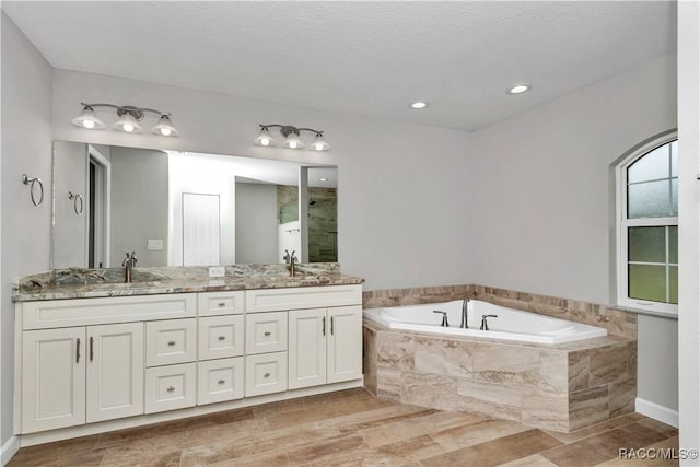 5443 N Nakoma Dr, Beverly Hills, FL 34465 - bathroom featuring a garden tub and double vanity