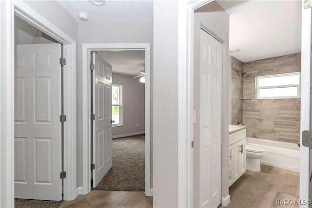 5443 N Nakoma Dr, Beverly Hills, FL 34465 - full bathroom with vanity, wood finished floors, shower / tub combination, and ceiling fan