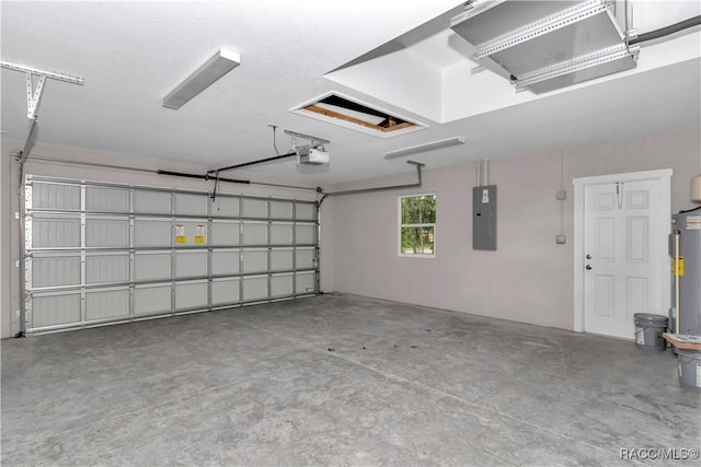5443 N Nakoma Dr, Beverly Hills, FL 34465 - garage featuring electric panel, a garage door opener, and water heater