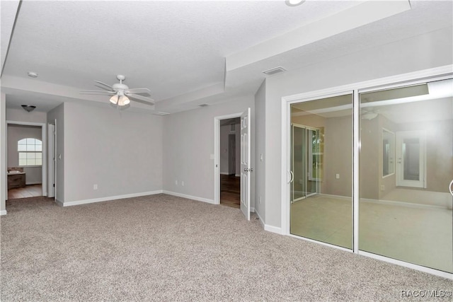 5443 N Nakoma Dr, Beverly Hills, FL 34465 - unfurnished bedroom with carpet, ceiling fan, a raised ceiling, and ensuite bath