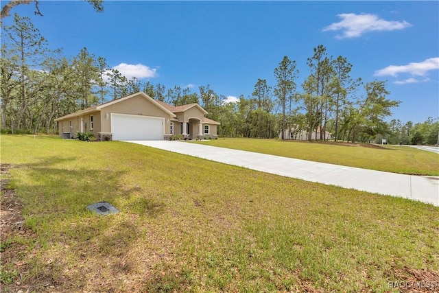 5443 N Nakoma Dr, Beverly Hills, FL 34465 - view of front facade with an attached garage, concrete driveway, a front lawn, and stucco siding