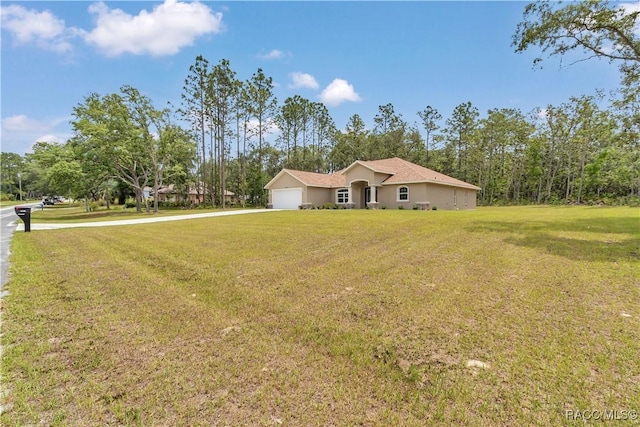 5443 N Nakoma Dr, Beverly Hills, FL 34465 - single story home with concrete driveway, an attached garage, a front yard, and stucco siding