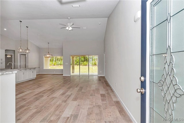 5443 N Nakoma Dr, Beverly Hills, FL 34465 - unfurnished living room with lofted ceiling, ceiling fan, and light wood finished floors