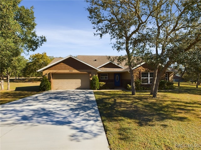 ranch-style home featuring a front yard and a garage