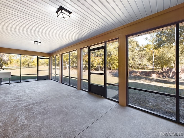 unfurnished sunroom featuring a healthy amount of sunlight