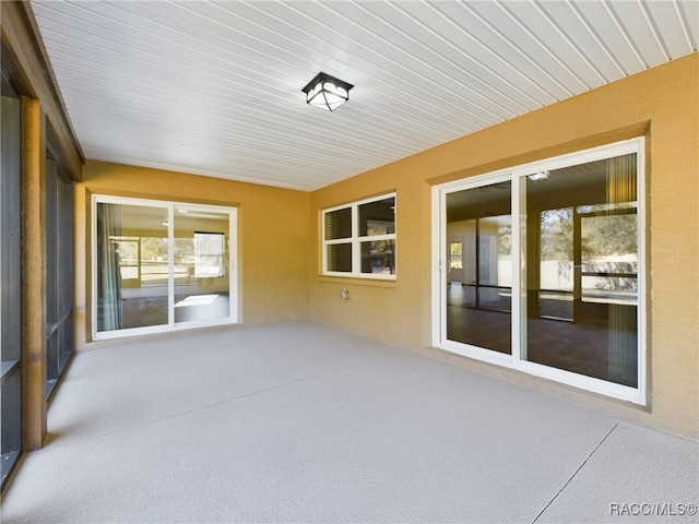 unfurnished sunroom with a healthy amount of sunlight