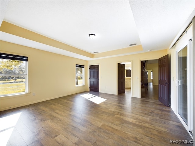 empty room featuring dark wood-type flooring