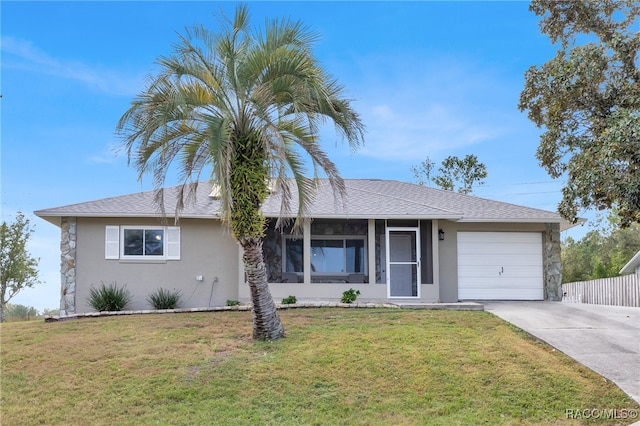 single story home with a garage and a front yard