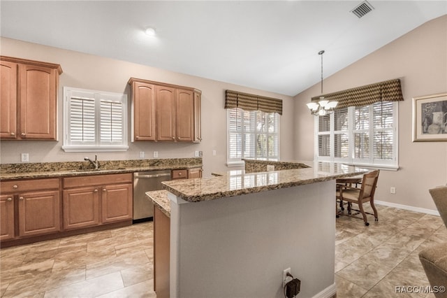 kitchen with dishwasher, stone counters, a center island, decorative light fixtures, and vaulted ceiling