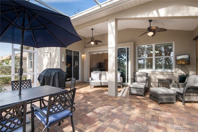 view of patio / terrace featuring an outdoor living space, grilling area, and ceiling fan