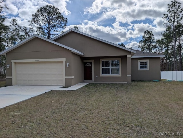 view of front facade featuring a garage and a front lawn