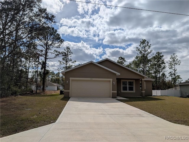 view of front facade with a garage and a front lawn