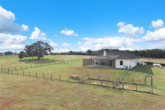 view of yard featuring a rural view and a lanai