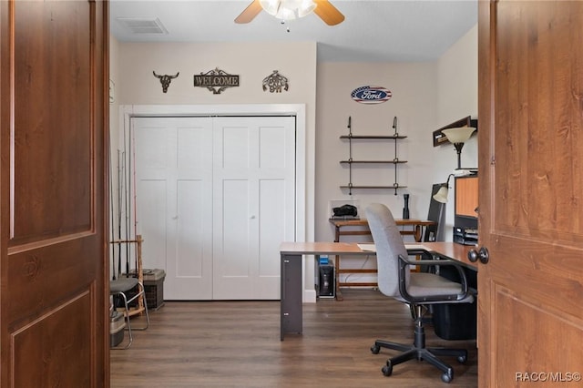 home office featuring ceiling fan and dark hardwood / wood-style flooring