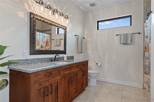 bathroom featuring tile patterned flooring, a shower with curtain, vanity, and toilet