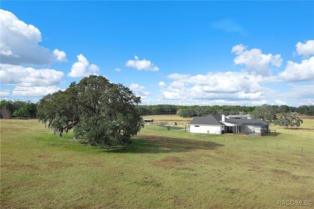 view of yard with a rural view