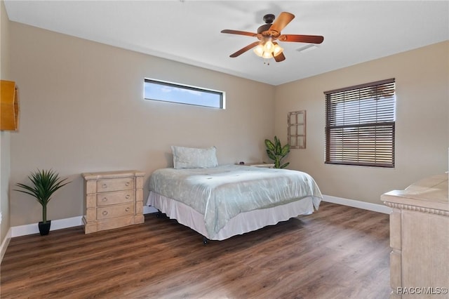 bedroom featuring ceiling fan and dark wood-type flooring