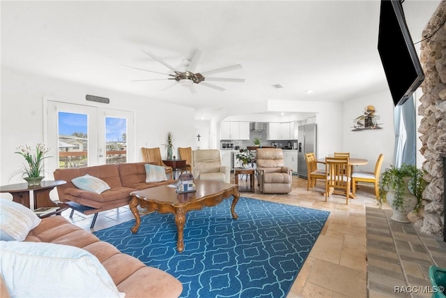 living room featuring french doors and ceiling fan