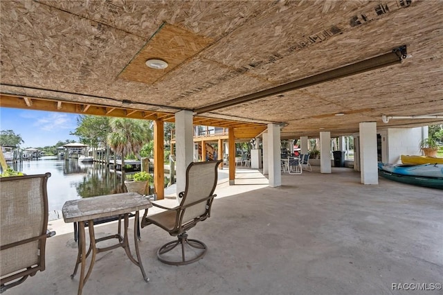 view of patio with a water view