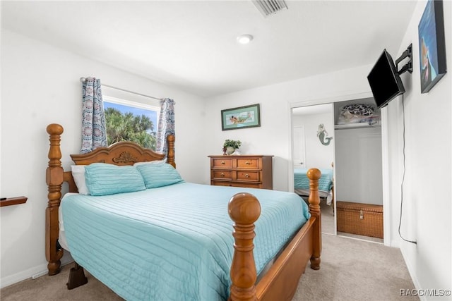 carpeted bedroom featuring a closet