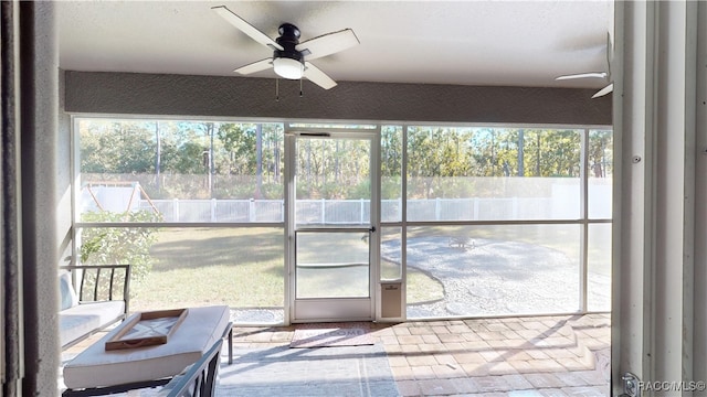 sunroom / solarium with ceiling fan