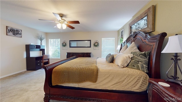 bedroom featuring ceiling fan and light colored carpet