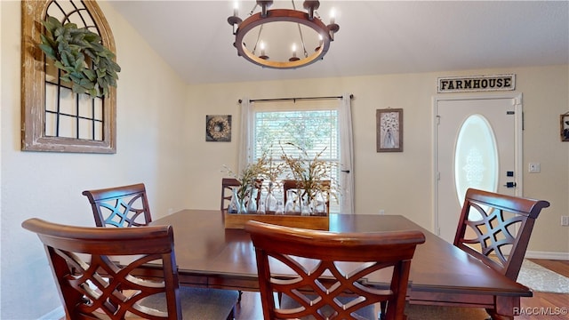 dining room featuring a chandelier and wood-type flooring