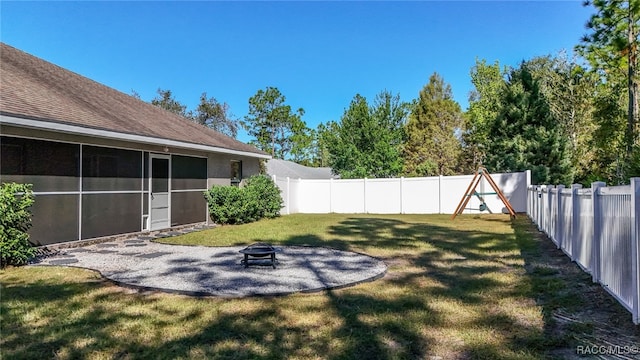 view of yard with a fire pit