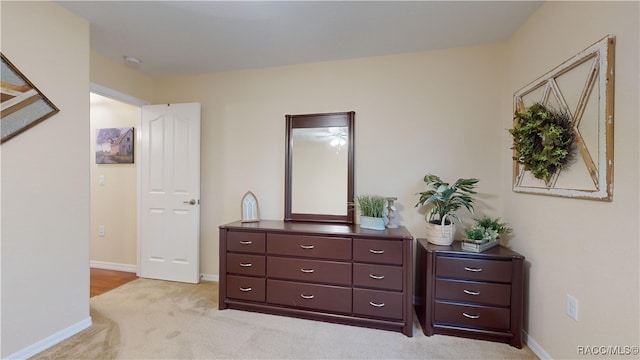 bedroom featuring light colored carpet