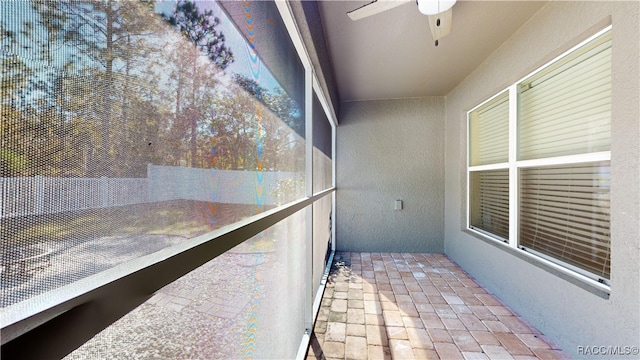 balcony featuring ceiling fan