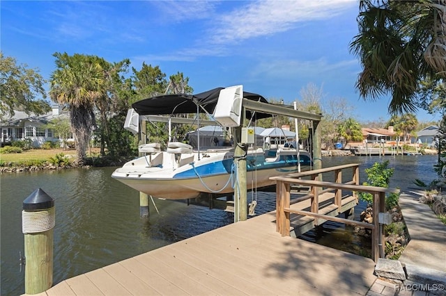 view of dock featuring a water view and boat lift