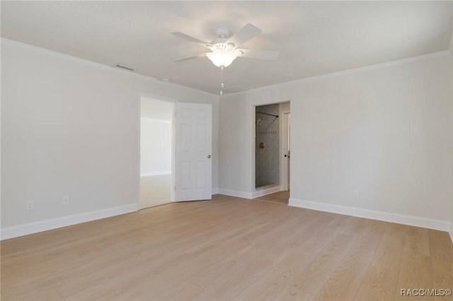 unfurnished room with visible vents, ornamental molding, a ceiling fan, light wood-type flooring, and baseboards