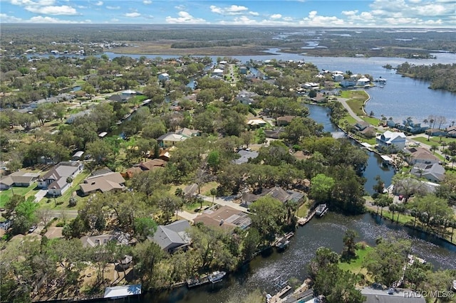 bird's eye view featuring a water view and a residential view