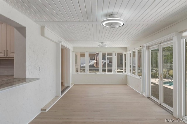 unfurnished sunroom with wooden ceiling