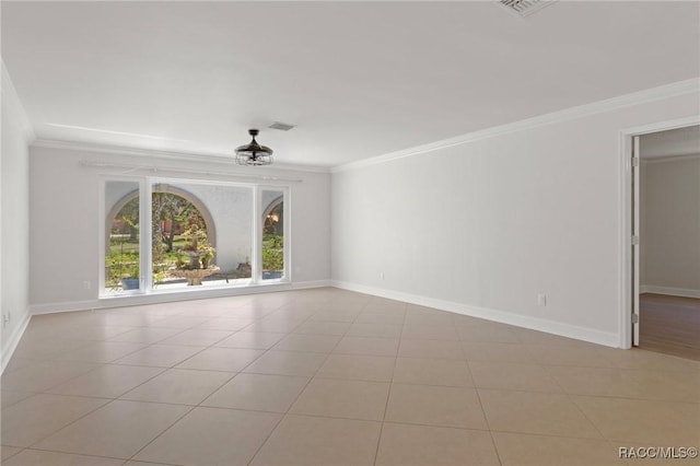 unfurnished living room with tile patterned flooring, baseboards, visible vents, and crown molding