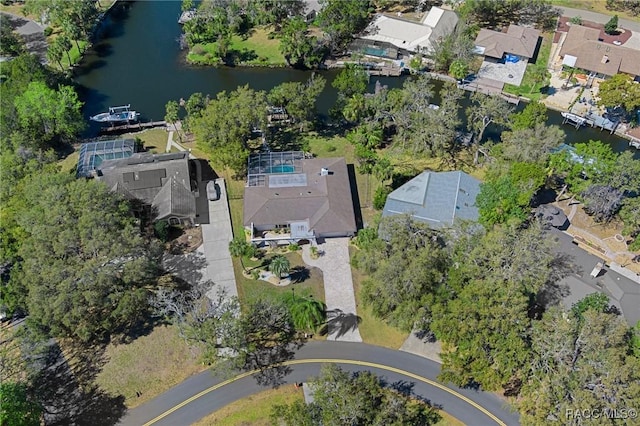 drone / aerial view with a water view and a residential view