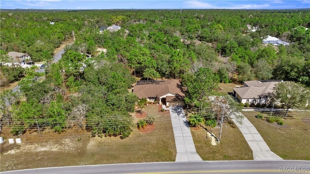 drone / aerial view featuring a forest view