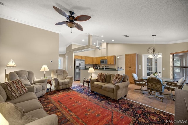 living room with a textured ceiling, lofted ceiling, light tile patterned flooring, ceiling fan with notable chandelier, and crown molding