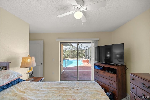 bedroom featuring access to exterior, a textured ceiling, a ceiling fan, and a sunroom