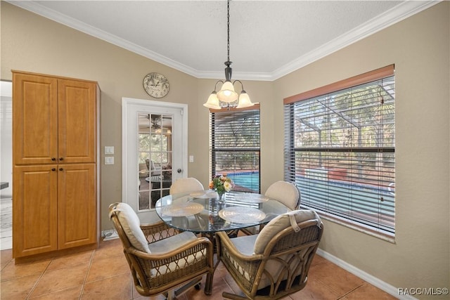 dining area featuring a healthy amount of sunlight, crown molding, baseboards, and light tile patterned floors