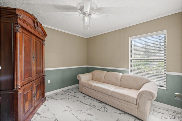 living area with marble finish floor, crown molding, a textured ceiling, and baseboards