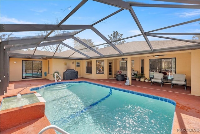 outdoor pool with ceiling fan, glass enclosure, a patio area, and area for grilling