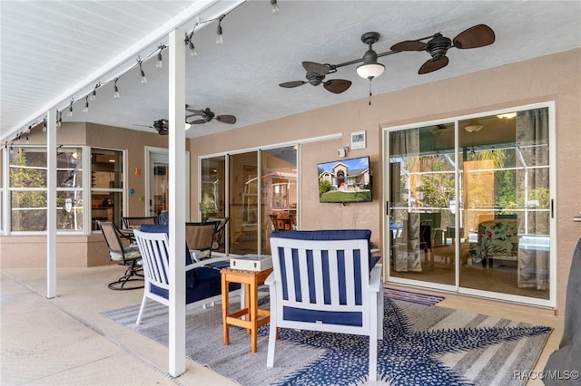 view of patio / terrace featuring ceiling fan