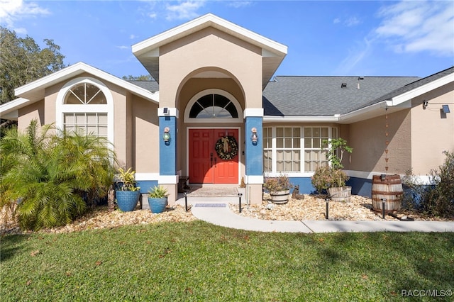 entrance to property with a yard